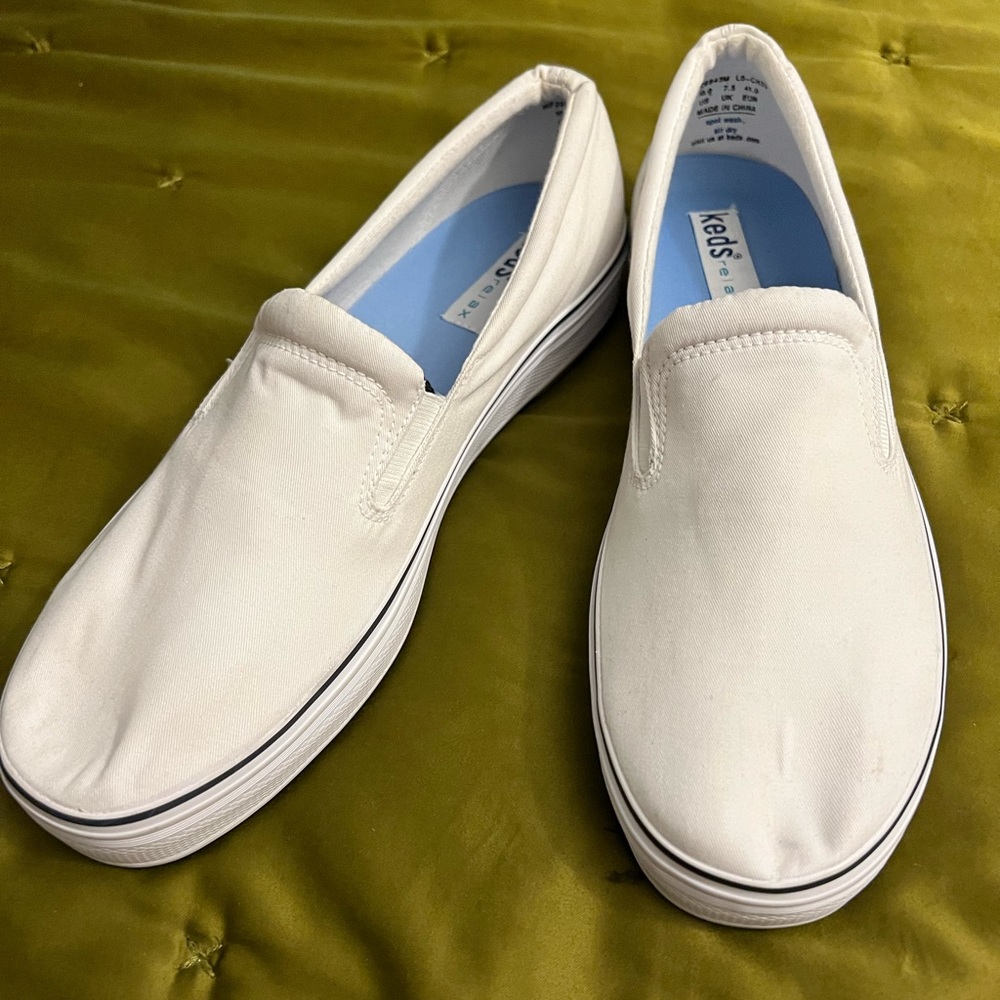 Classic slip-on Keds! Never worn. All white with one single dark stripe. Size 10